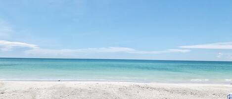 On the beach, sun-loungers, beach towels