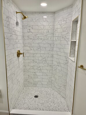 Bathtub, jetted bath, hair dryer, towels