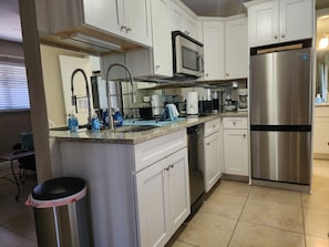 Fridge, microwave, dishwasher, coffee/tea maker