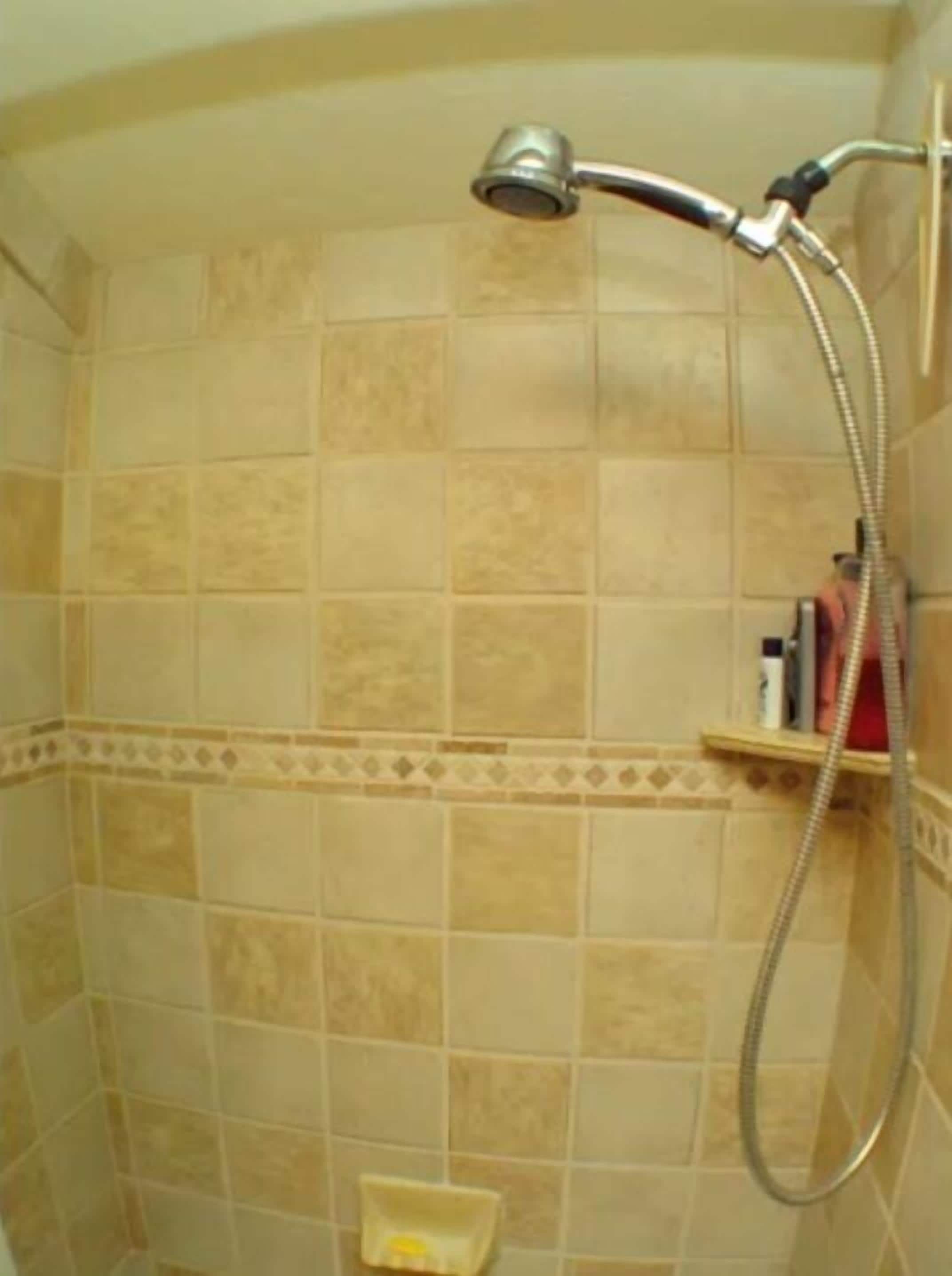 Combined shower/tub, hair dryer, towels, soap