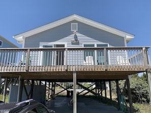 A two-story house with a covered deck and a garage. - Rideout's Hideout - Easy Beach Access - Sound Views - Family & Pet Friendly (Topsail Beach)