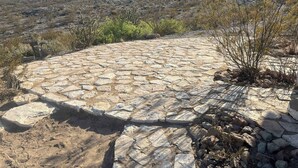 A stone pathway leading to a building with a mountainous backdrop. - Big Bend Getaway: Classic Adobe with Modern Flair (Terlingua)