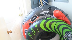 Three inflatable rings with different designs and colors.