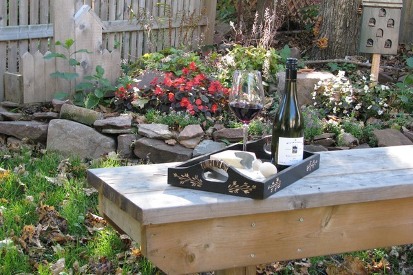 Enjoy some wine and cheese in landscaped yard