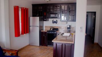 Fridge, microwave, stovetop, coffee/tea maker