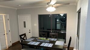 A dining area with a table, chairs, and a ceiling fan. - Very Best Sunset! Deep Water! 149ft waterfront-4BR/Sleeps 14, New Remodel (Mabank)
