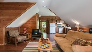 TV, DVD player, books, video library - Charming cabin with Fire pit, outdoor seating and grill, covered pavillion. (White Oak)