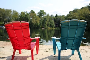 On the beach, sun-loungers - Lakeside Ranch Cabin. (Tomah)