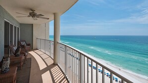 A balcony with wicker furniture, a ceiling fan, and a view of the ocean and beach. - LONG BEACH RESORT Tower 2, 13th Floor 1 Bdr!!  Awesome Views! Beautiful Unit!!! ! (Panama City Beach)