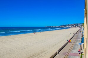 On the beach, sun-loungers, beach towels