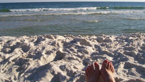 A sandy beach with waves in the background. - 2BR 2 BA 5th floor beachfront condo. Call Now! (Gulf Shores)