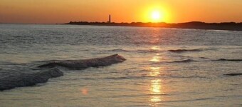 Cozy Condo steps to the beach. 3 BR, 2 BA, Reserved parking and Outdoor Shower.