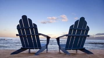 On the beach, sun-loungers