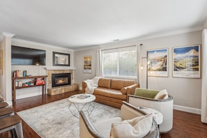 Smart TV, fireplace, books, printers