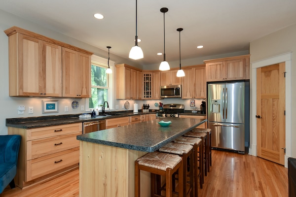 Prepare meals in the roomy, well-equipped kitchen with island.