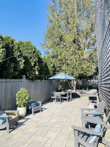 1000 sq ft patio. Outdoor shower. Grill.