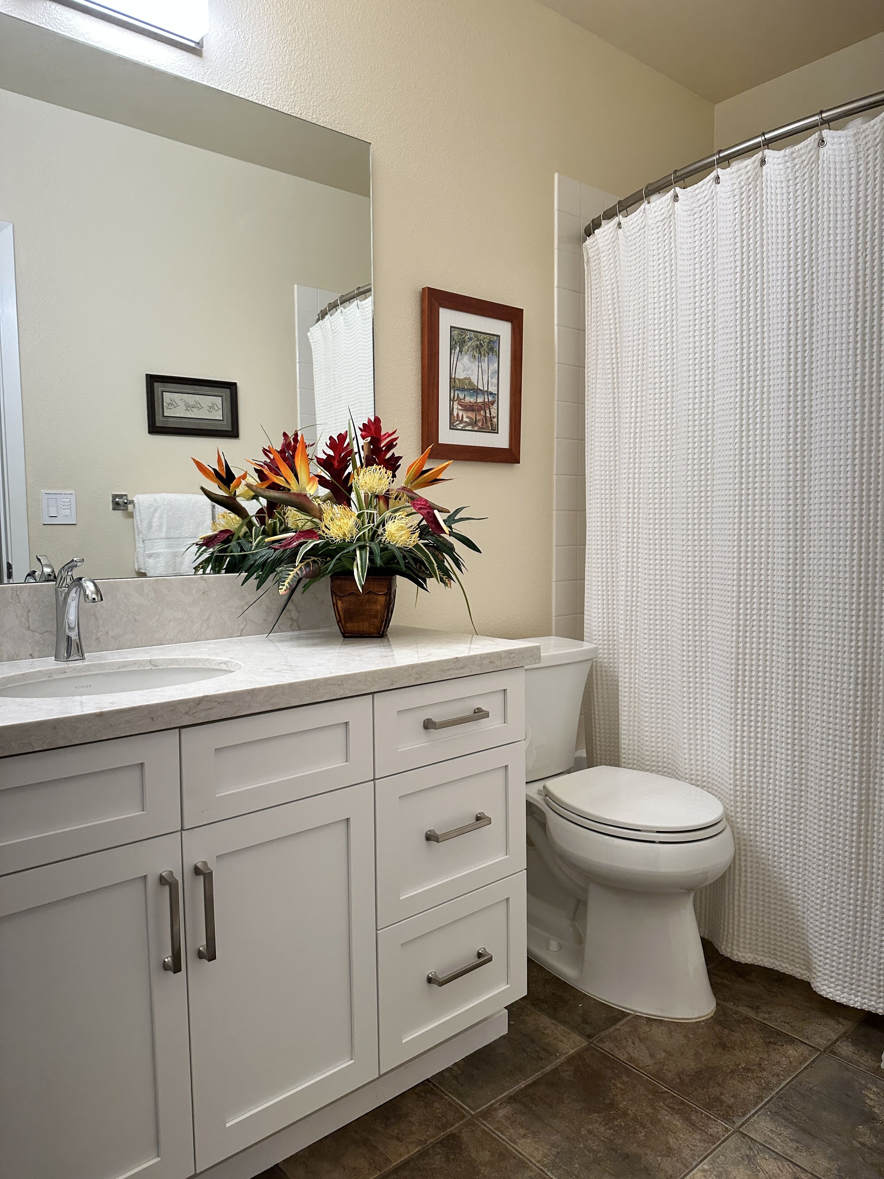 Combined shower/tub, hair dryer, towels, soap