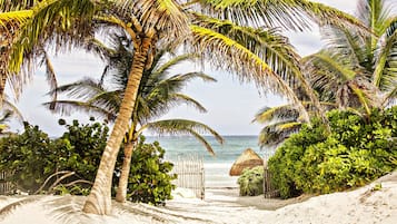 On the beach, sun loungers, beach towels