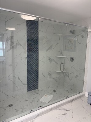 Shower, hair dryer, towels, soap