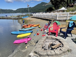 Pictured are our 6 kayaks, 2 of which are for children, sandy beach, & fire pit 