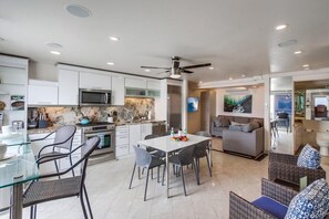 Enjoy cooking and dining in this well-equipped kitchen with a central island and adjacent living area.