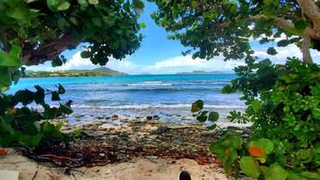On the beach, sun loungers, beach towels