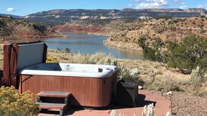 A hot tub with a view of a lake and mountains in the background. - Stellar, Southwest, Luxury home.  Extraordinary location on Abiquiu Lake (Gallina)