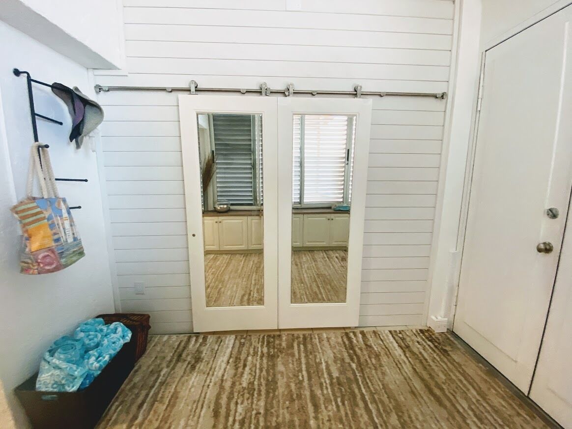 ACT FAST---STUNNING 3 BEDROOM 3 BATH WITH BONUS DEN AND BIGGER BEACHFRONT LANAI!