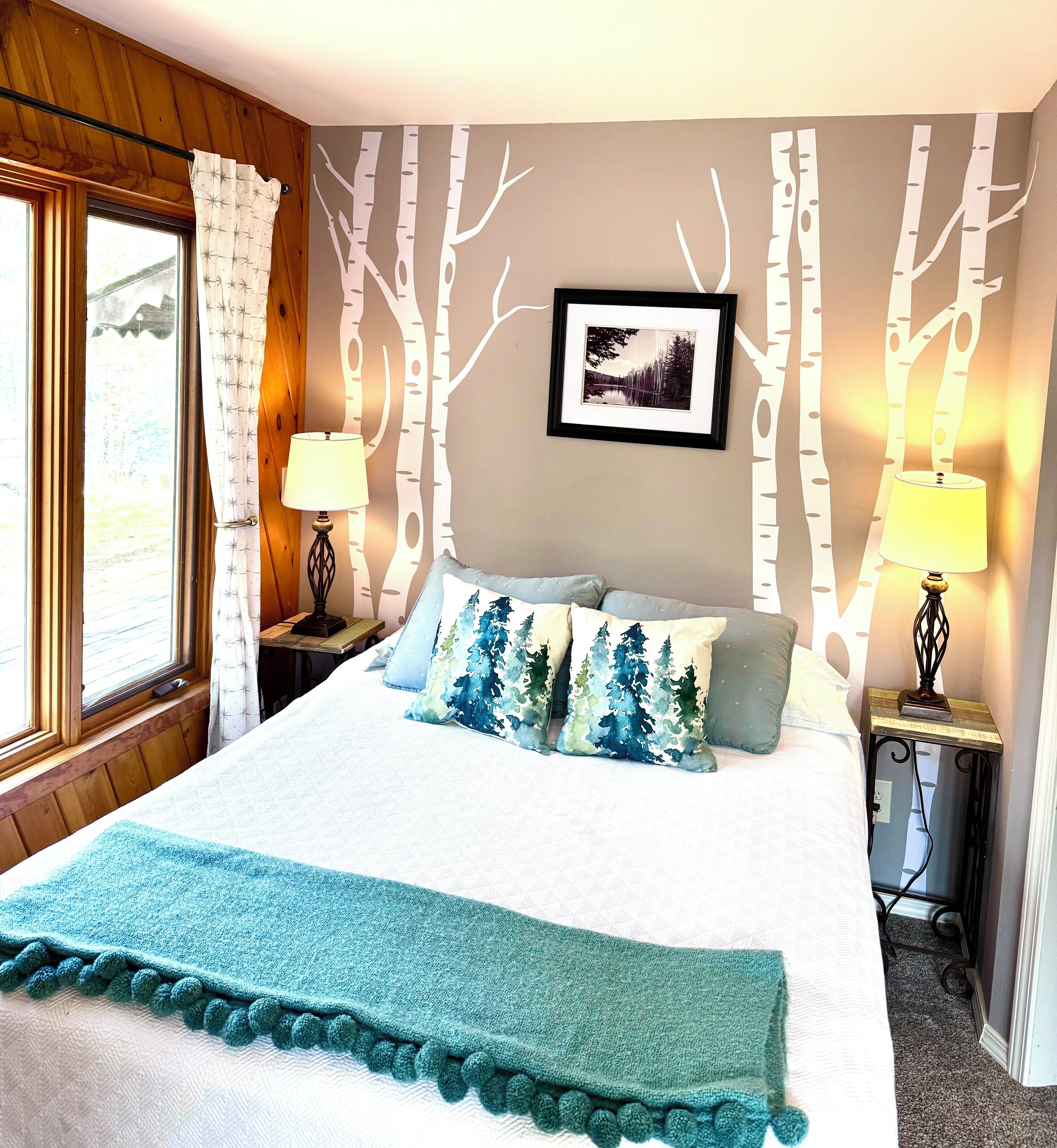Main floor bedroom with large windows
