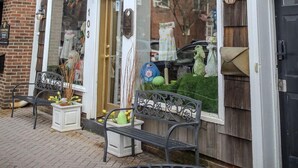 A storefront with a sign reading "Fairy Godmother" and a brick building facade. - The Rodney House (Lewes)