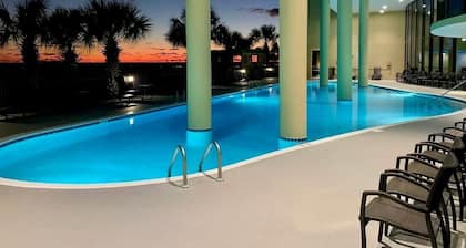 TOP FLOOR with PENTHOUSE views! BEACHFRONT- 2 BDRM-2 BATH, 2 POOLS and HOT TUB!