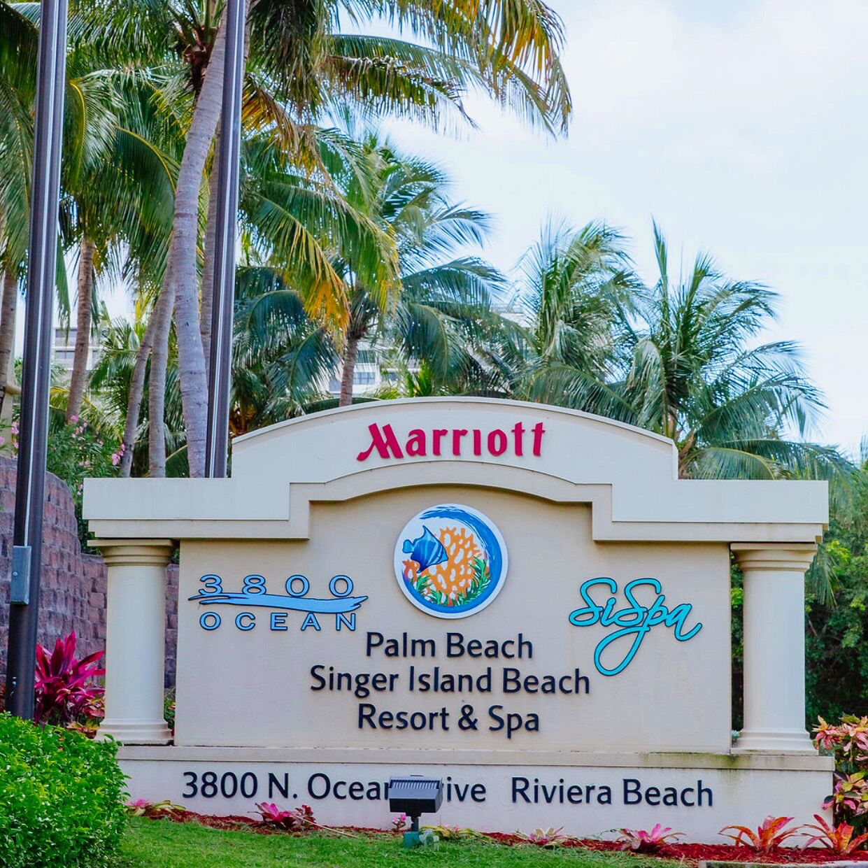 A sign for the Marriott Palm Beach Singer Island Beach Resort & Spa, including the address 3800 N. Ocean Drive, Riviera Beach.