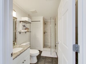A modern bathroom with a toilet, sink, and shower area. - Majestic Sun 909A. Beautiful Unit. Book today. Video Link! (Destin)