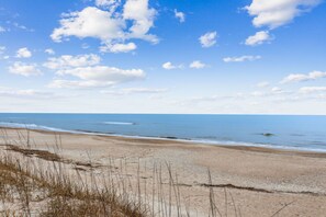 Enjoy a serene beach experience with access to the calm sea.