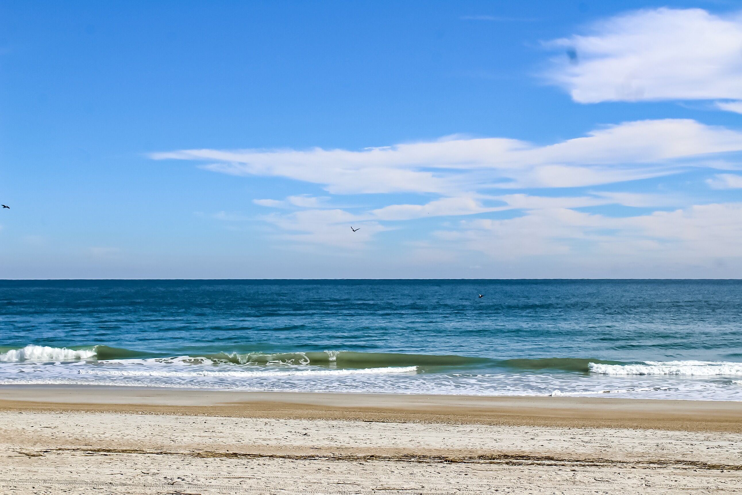On the beach, sun loungers, beach towels