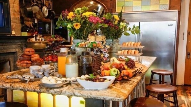 A breakfast bar with various food items, including pastries, fruits, and beverages. - Fleur De Lis Mansion ,pool, near French Quarter & Superdome lic.Bnb  317134 (New Orleans)