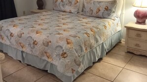 A bedroom with a bed, nightstands, and a lamp. - Beachfront - 2 bedrooms for price of one! (Pensacola)
