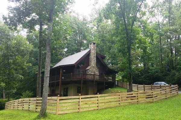 Cabin nestled in woods next to Big Brasstown Creek