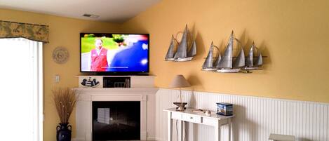 Smart TV, fireplace, DVD player, books