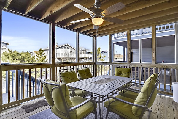 Covered and screened porch off kitchen