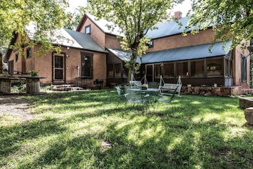 Peaceful backyard with lovely covered porch.