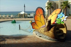Poolside sculpture and ocean views surround this resort's tranquil atmosphere.
