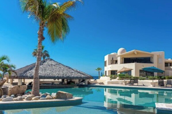 Outdoor pool, a heated pool - ALL NEW remodeled condo! Ocean Front on Beach 2 Bd 2 Ba Upper Level (Cabo San Lucas)