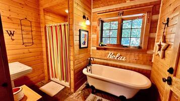 Bathtub, hair dryer, towels, soap