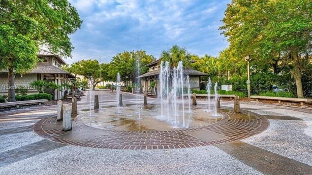 A public square with a central fountain, surrounded by trees and benches. - SOUTH FOREST BEACH. Coligny, pool. walk to beach. updated. sleep 8. 
SURF COURT (Hilton Head Island)