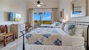 A bedroom with two beds, a ceiling fan, a TV, a desk, and a chair. - Amazing Cabo Villa-Beautiful Palmilla-Near Beach (San Jose del Cabo)