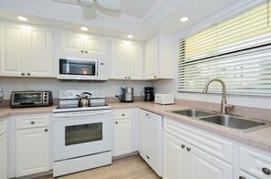 Enjoy cooking in this well-equipped kitchen with a microwave, stovetop, coffee maker, and toaster.