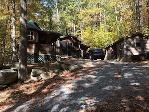 Sauna cottage on left, cabin in middle, workshop on right