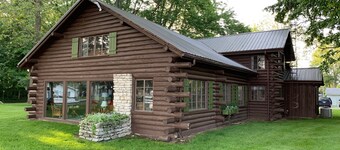 Stunning lakefront log cabin on a private acre