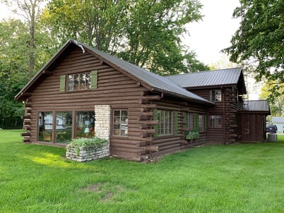 Stunning lakefront log cabin on a private acre